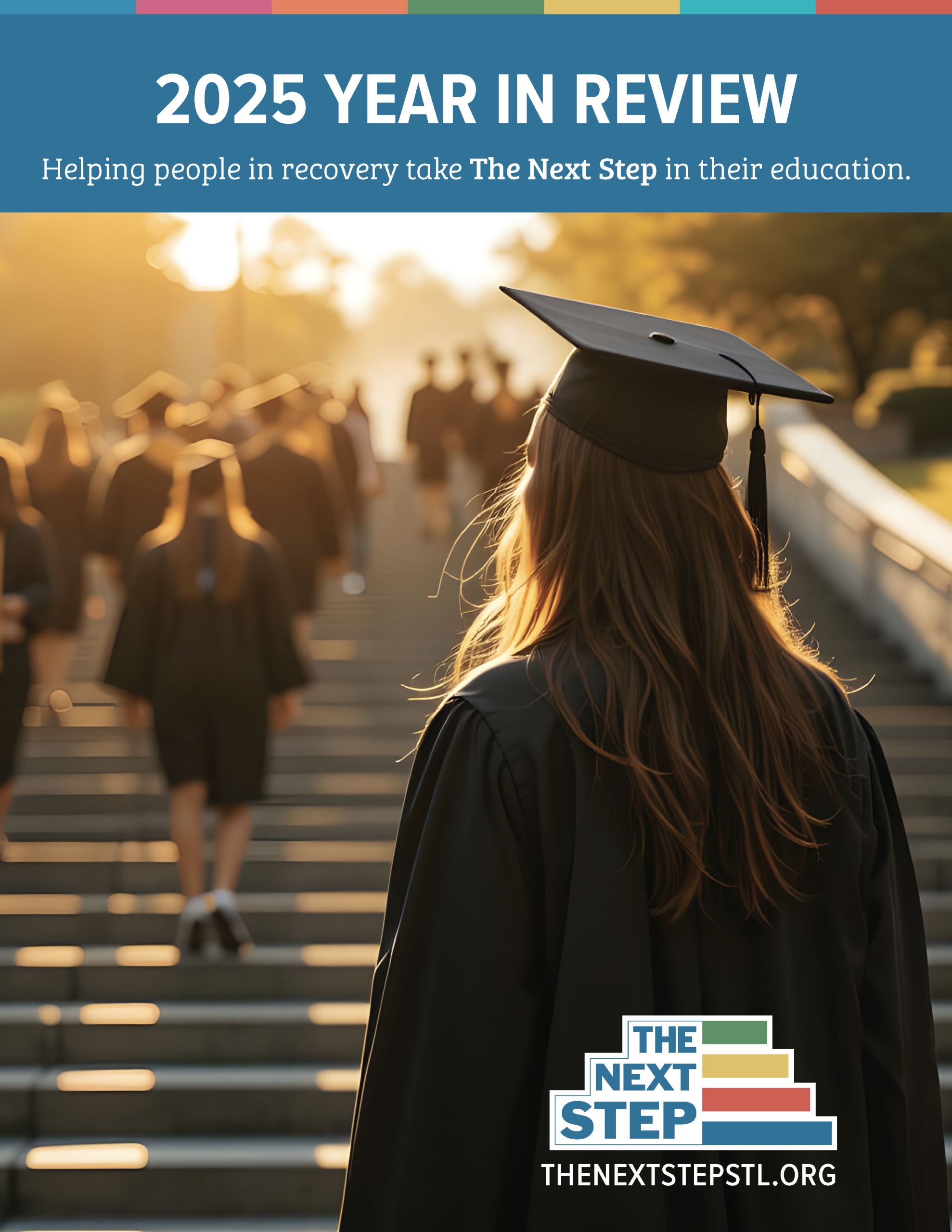 Woman smiling in library holding a book